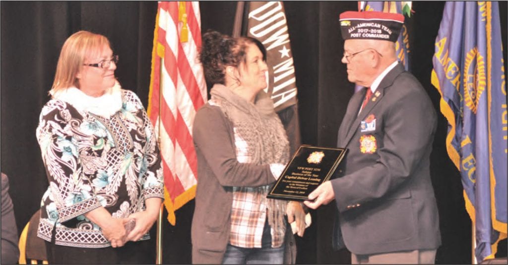 Joshua D. Desforges VFW Post 3236 of Ludlow Commander Paul Chrzan issues a plaque to representatives of Capital Driver Leasing, LLC who were chosen as the business of the year for their contributions including the Wreaths Across America campaign.